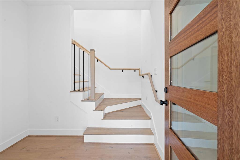 Entry foyer. This home will come with horizontal stair rails.