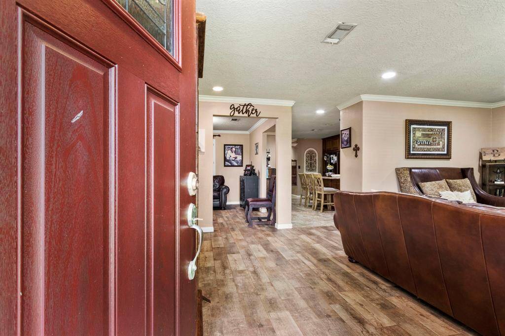 Entry looking in to the Living room. As previously stated the home has been updated almost throughout. This is a move in ready home. Very tastefully completed with outstanding craftsmanship and materials.