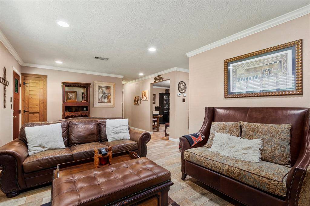 Taken from the fireplace area in the living room, Hallway to the left and flex room to the right.