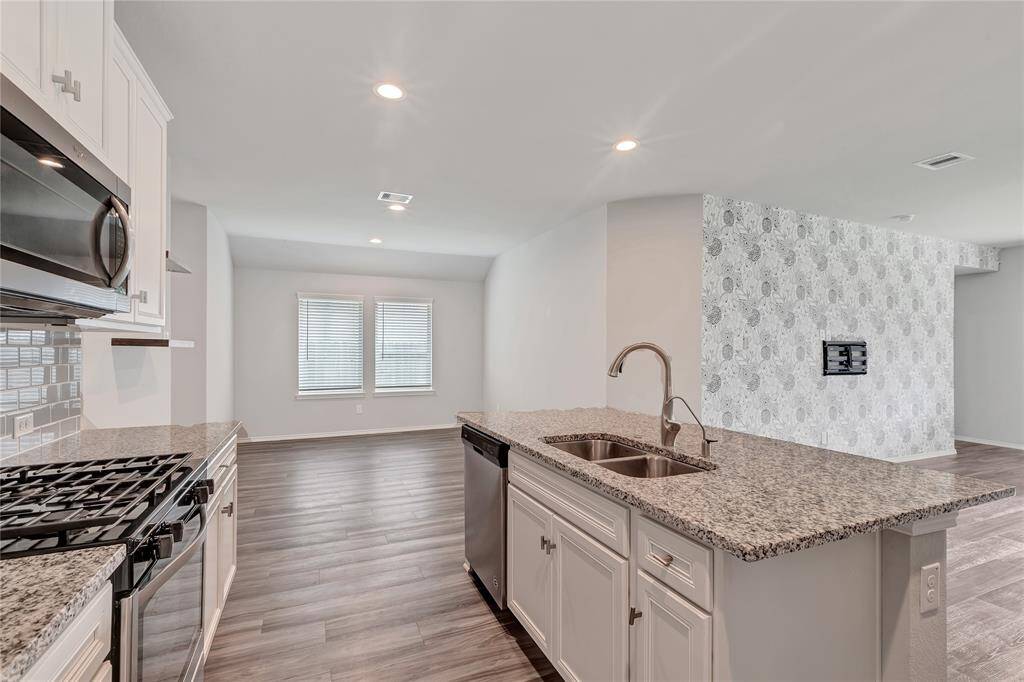 Kitchen and dining and living to right