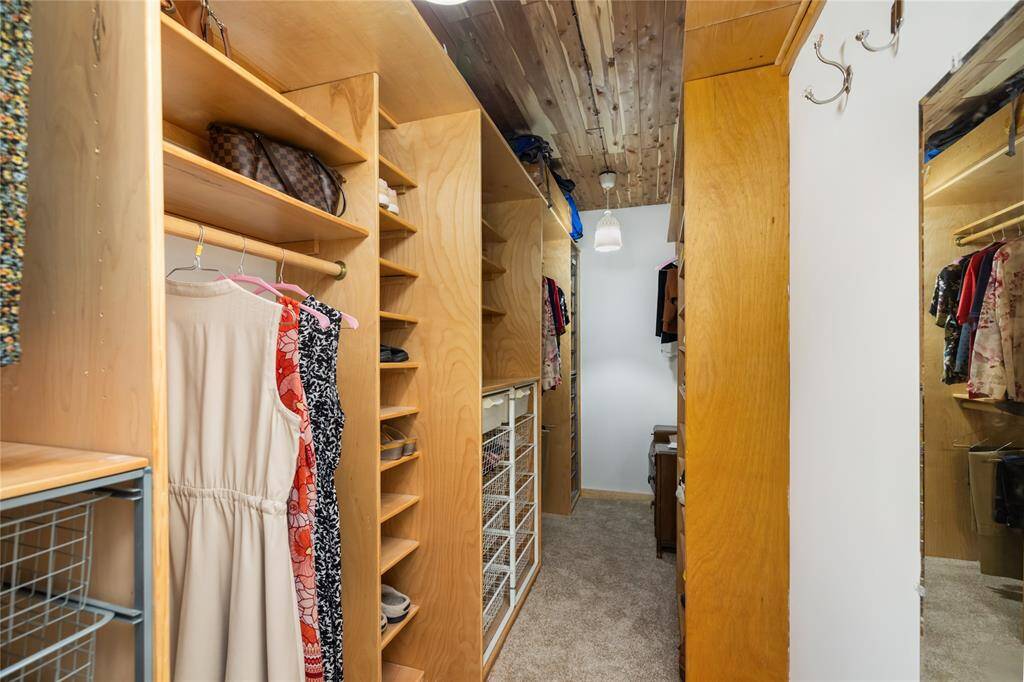 The primary also features dual closets with cedar ceilings