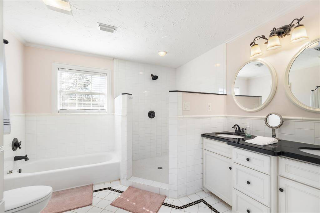 The second bathroom has double sinks, a walk-in shower, and separate tub!