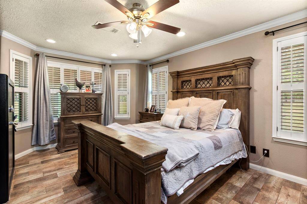 Master bedroom with abundant natural light. Plantation shutters adorn the home throughout.