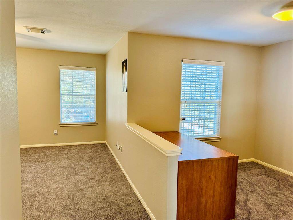 Upstairs primary bedroom with sitting area