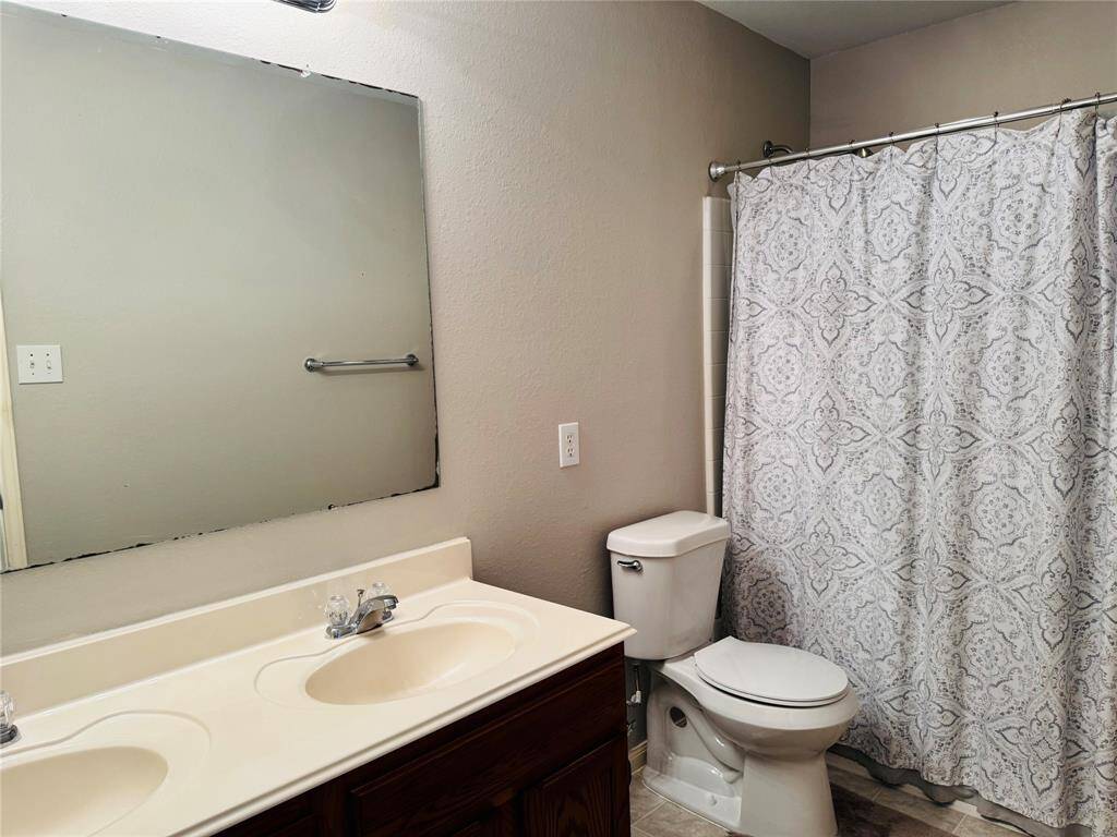 Upstairs bathroom with dual sinks