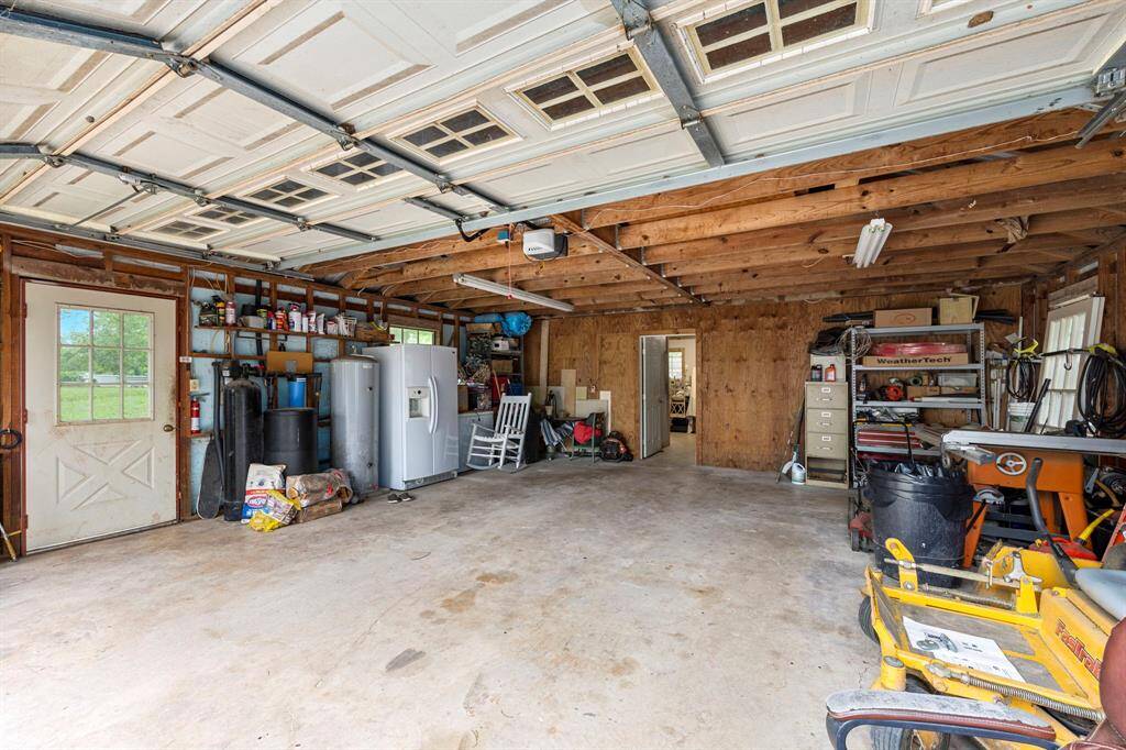 Interior of the garage has space for two vehicles and lots of extra room for tools/equipment, etc. Garage door opener was just replaced.
