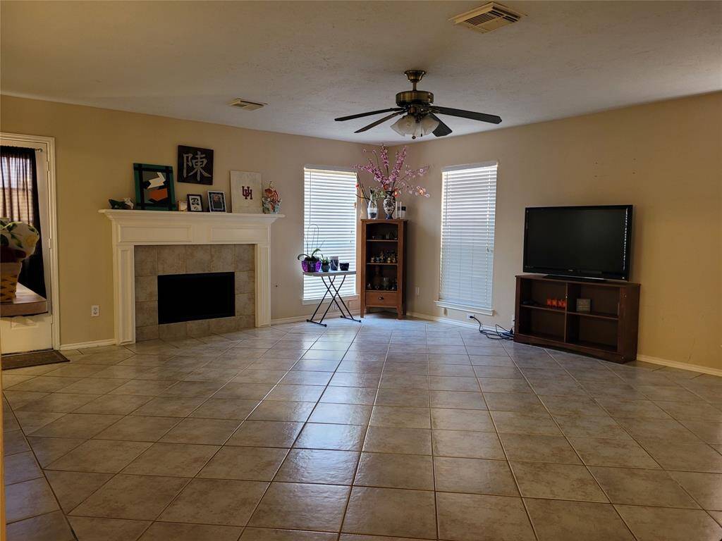 Imagine yourself sitting in front of a fireplace in this cozy living room