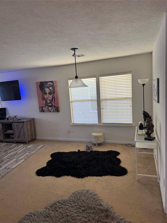 View of large living/dining space when home was furnished.