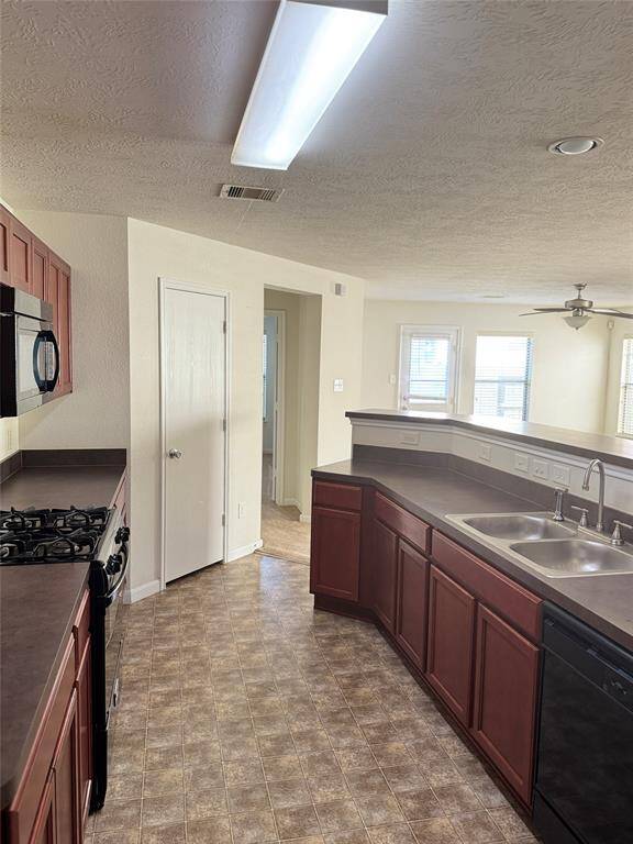 Laundry Area with built-in shelving. Washer Stays.