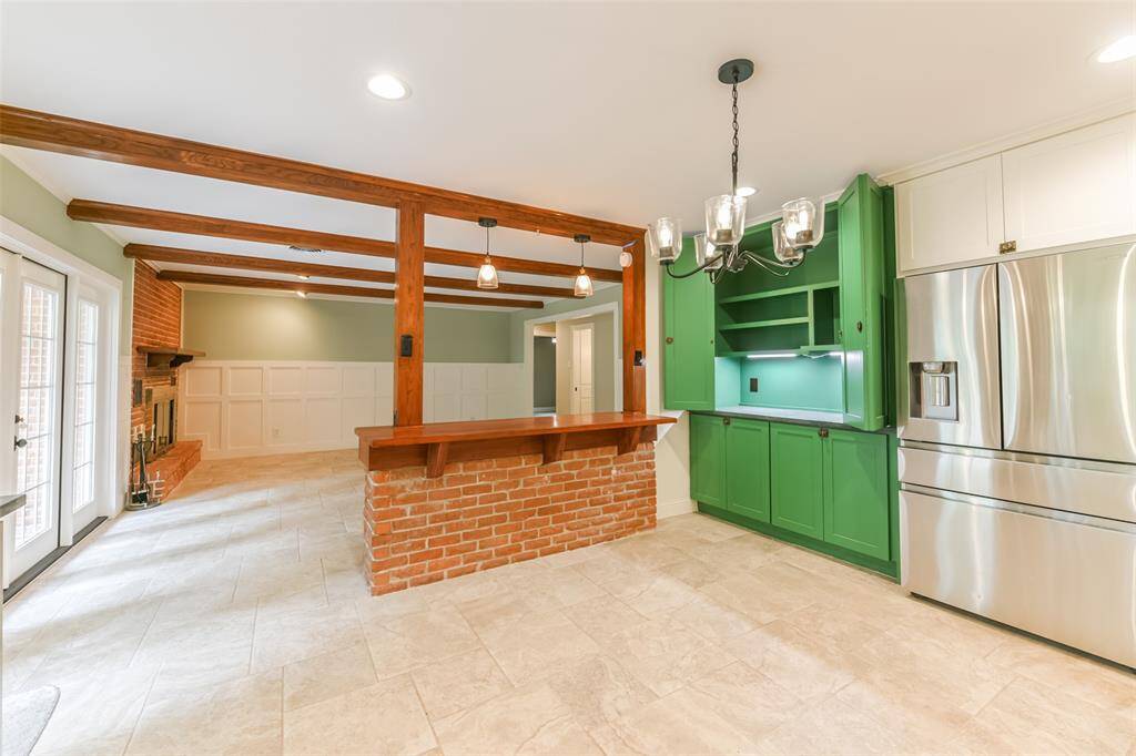 kitchen has custom  built in pantry cabinet