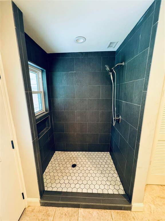 Extra shower in laundry room for washing pets or your dirty shoes from the pasture