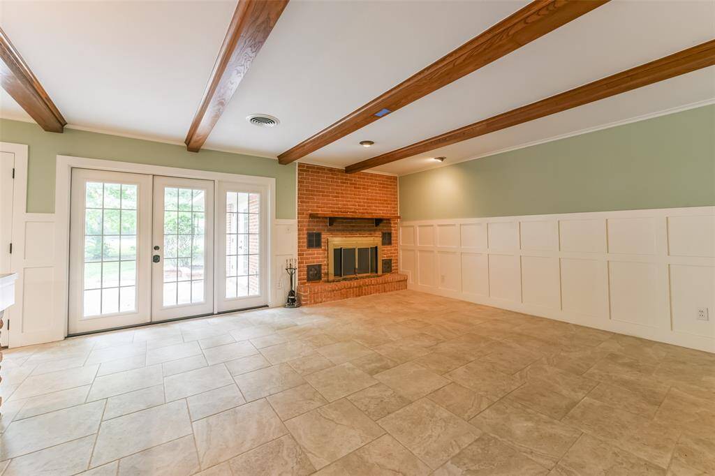 family room with fireplace and Frenchdoors