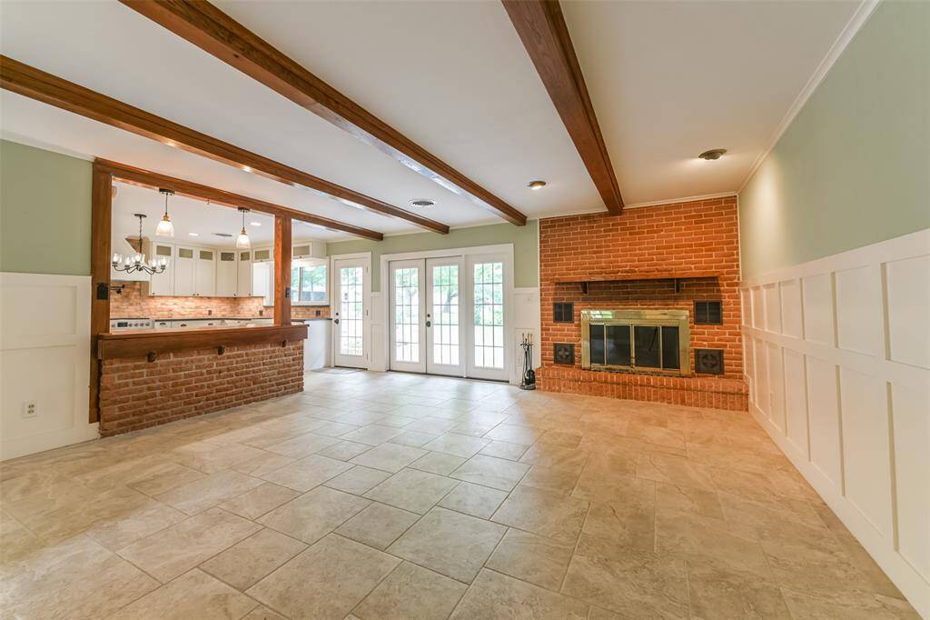 family room with fireplace open to kitchen