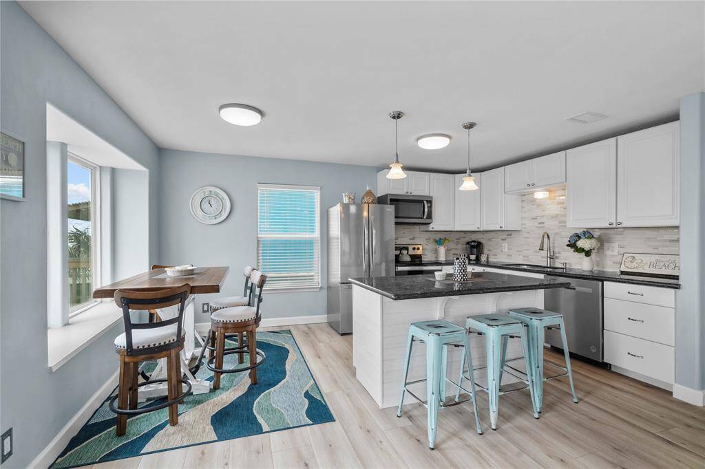 Kitchen & Dining area. All furnishings and appliances are included in the sales price.