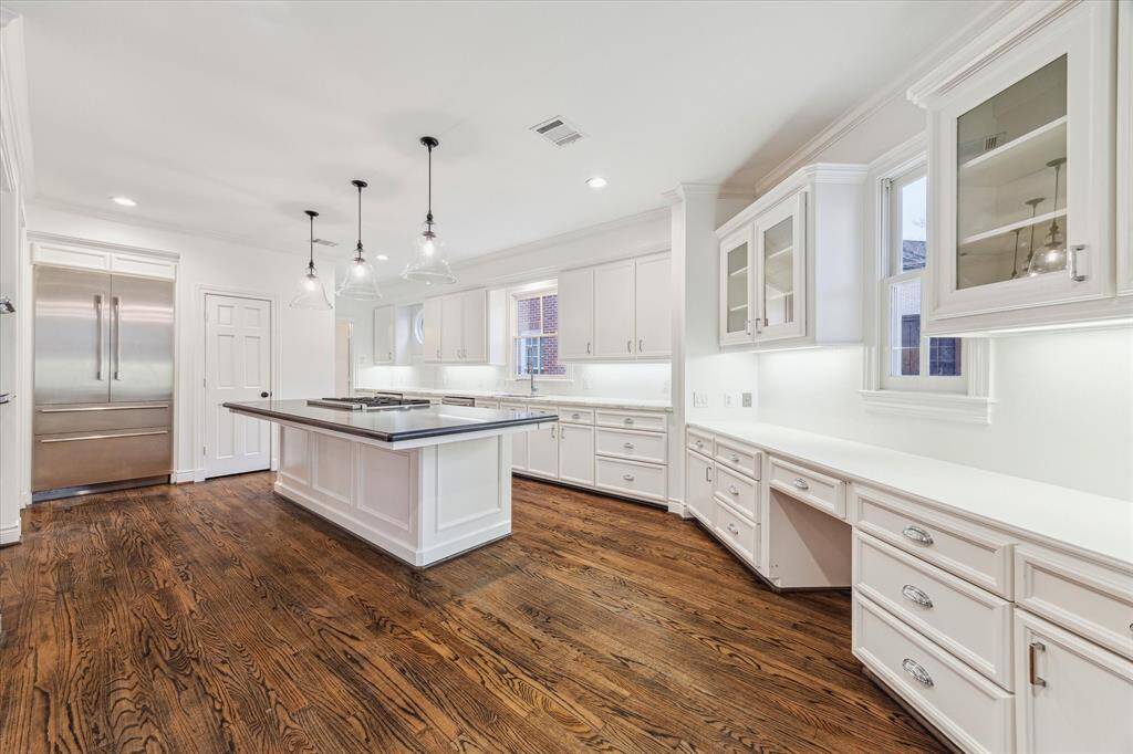 Spacious kitchen with desk area and breakfast room.