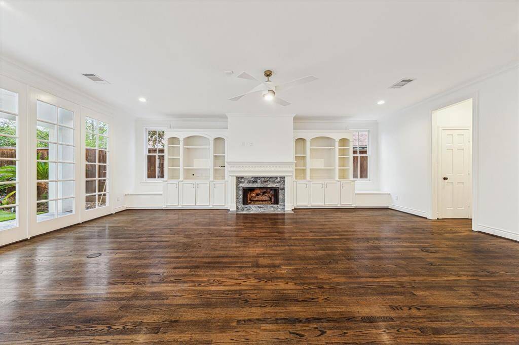 Family Room approx. 25'X19'. Natural light, built in storage, shelving, side seating with underseat storage.  Half Bathroom privately located to the right, along with coat closet and storage room.