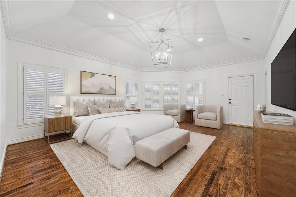 Virtually Staged Primary Bedroom. Primary has crosswalk leading into the apartment garage guest suite.