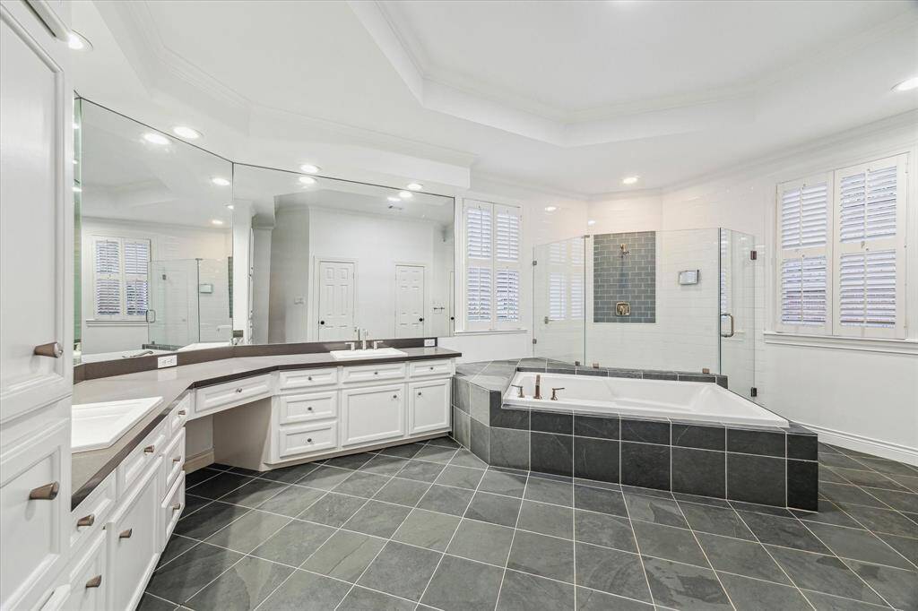 Primary ensuite. Adjacent is a large walk-in closet with 2-separate door entries.
