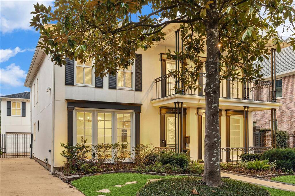 Side view showing remote gate access and a glimpse of the apartment garage.  Welcome to 3779 Tangley Rd.!