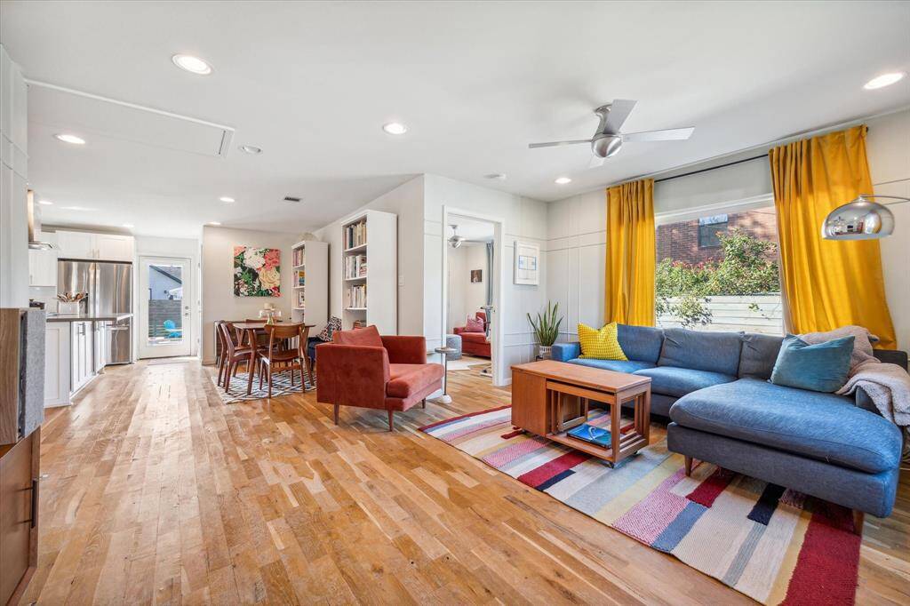 White oak hardwood flooring flows seamlessly throughout, guiding you to the designated dining area, which opens effortlessly to the living room and kitchen—perfect for entertaining.