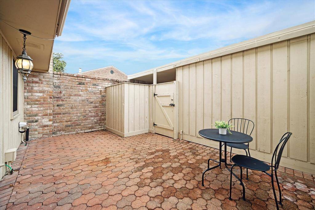The gate leads to the carport and garage.