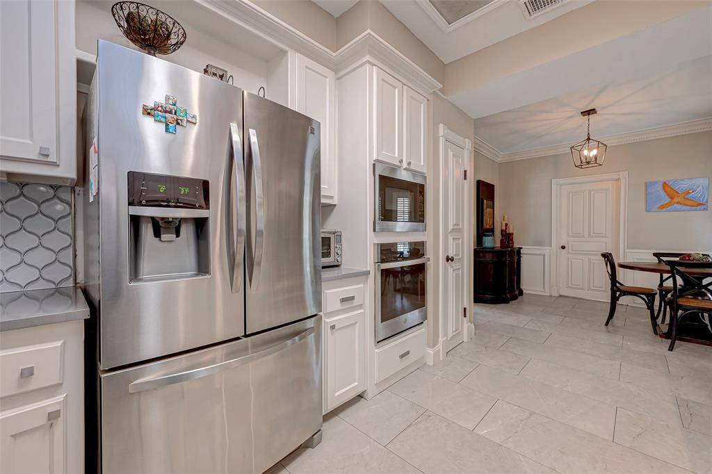 Kitchen is designed with a perfect space for a counter-depth refrigerator. NOTE: Refrigerator is NOT included.