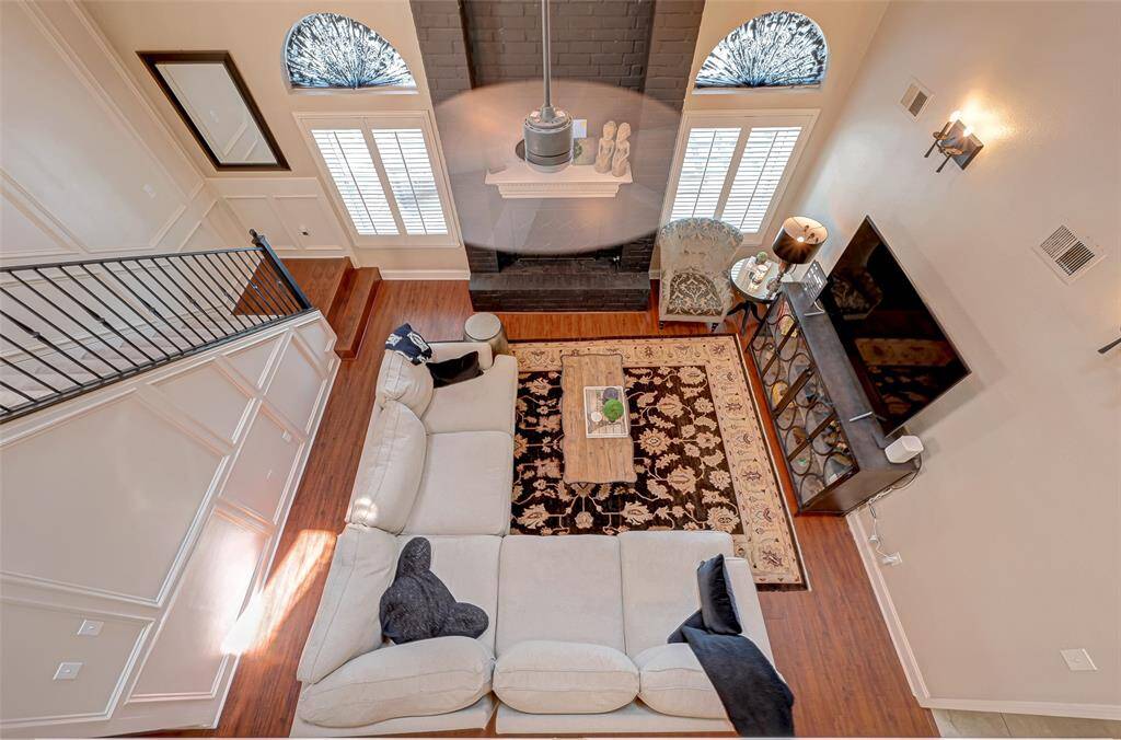 From the second-floor gameroom, you'll enjoy a captivating view of the spacious living room below, creating an open and interconnected atmosphere in the home.