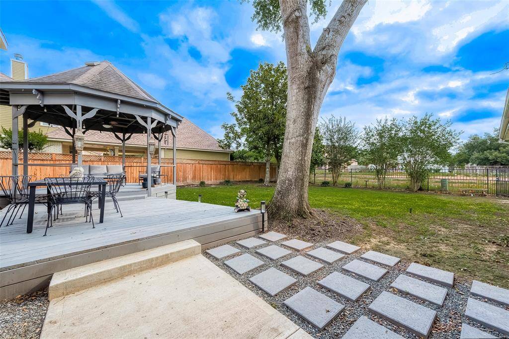 The elevated deck offers an ideal setting for a table and chairs, perfect for alfresco dining and outdoor entertaining. It provides a great vantage point to enjoy the view of the backyard, making it easy to watch kids play while you relax and dine outdoors.