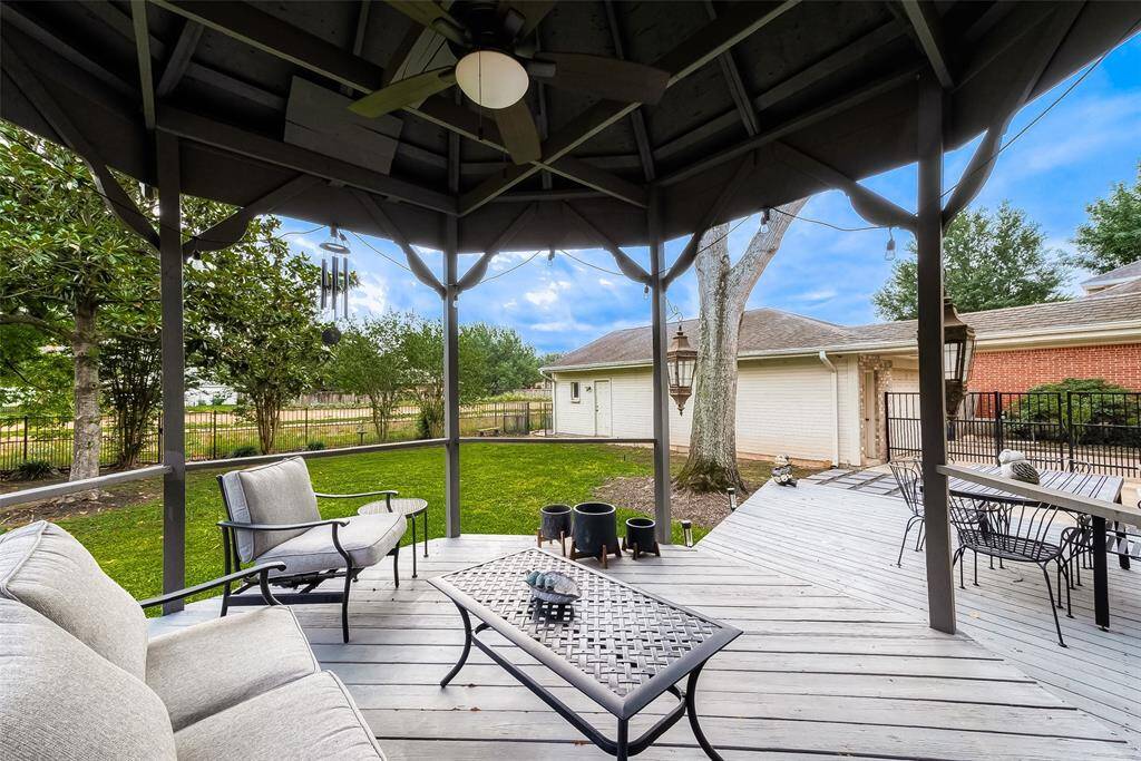 The gazebo is thoughtfully equipped with a lighted ceiling fan, adding to its charm and functionality. It serves as a peaceful and shaded retreat, creating a comfortable outdoor space to enjoy, whether it's a quiet moment alone or gathering with friends and family.