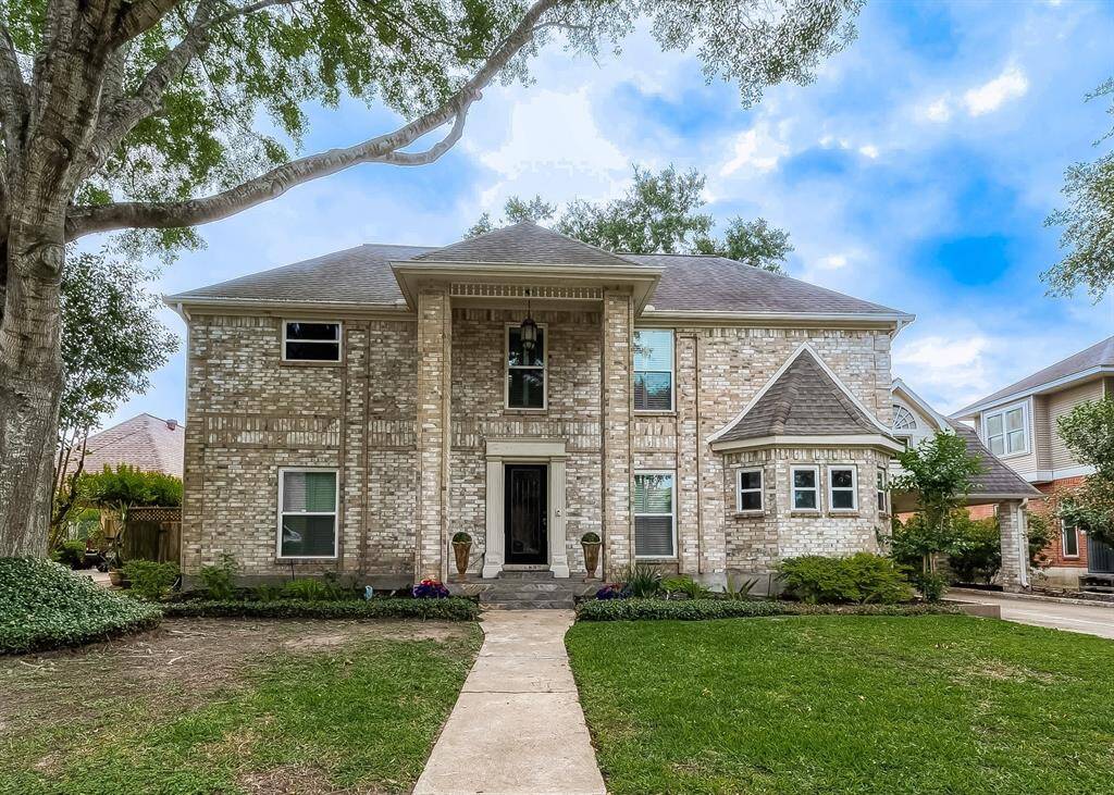 Welcome to this charming traditional home with a step-up entry graced by a beautiful lead glass front door. Its classic brick exterior is complemented by functional gutters. Inside, enjoy the energy efficiency of DOUBLE PANE LOW-E WINDOWS (2020) while outside, the front and backyards are adorned with a FULL SPRINKLER SYSTEM, adding convenience and beauty to the property.