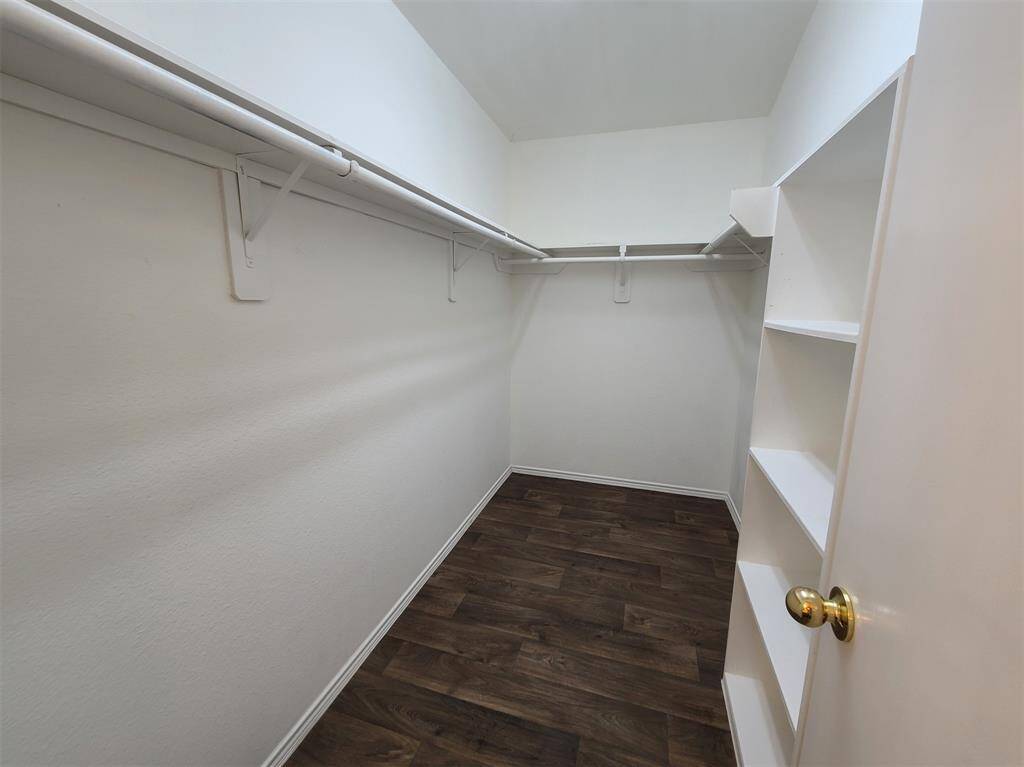 Spacious primary walk in closet off of primary bath.