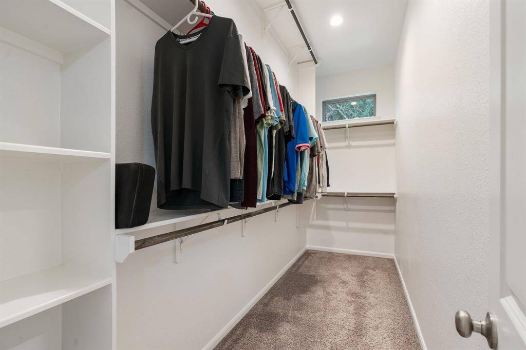 Primary bedroom walk-in closet.