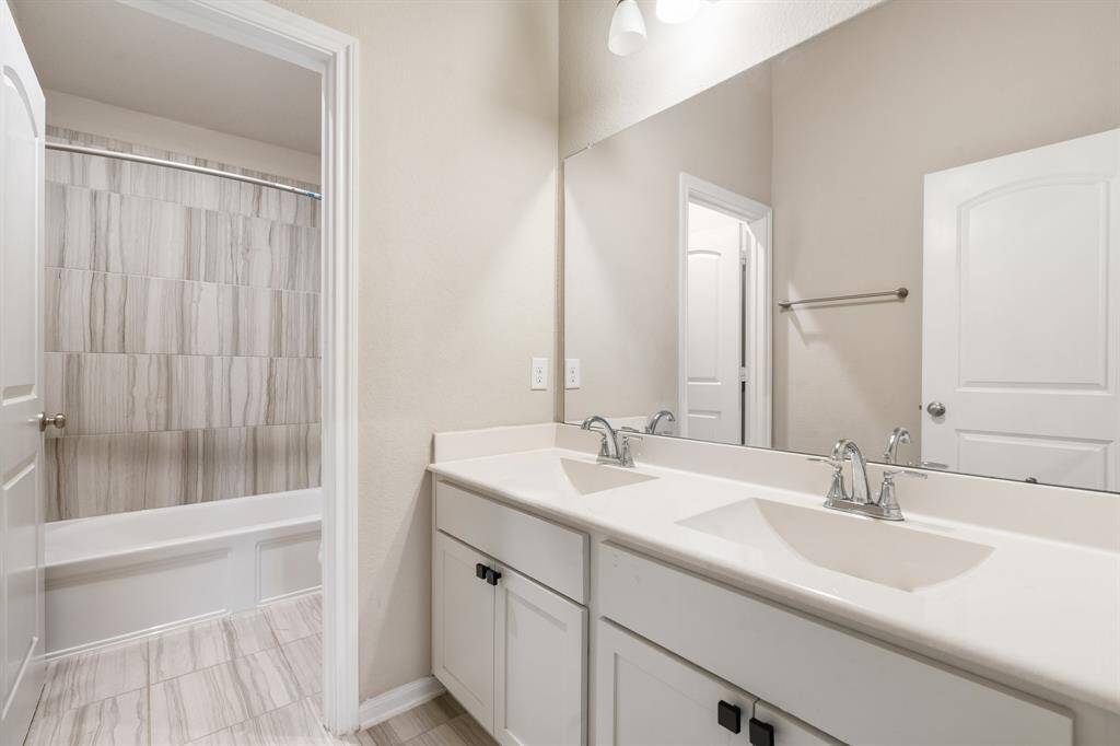 Upstairs bathroom with double sinks.