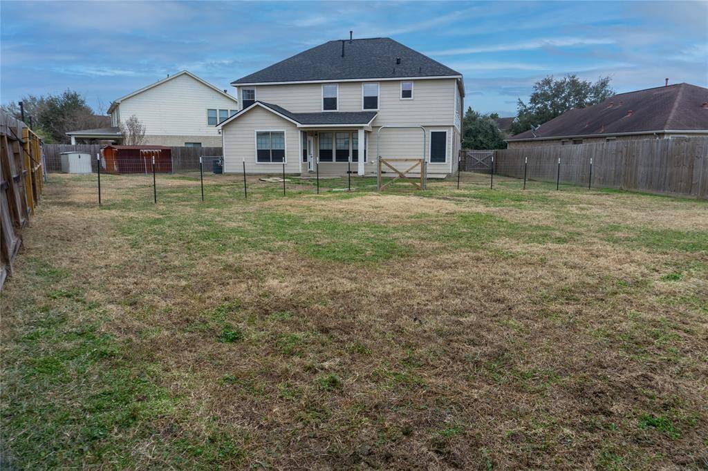 Huge back yard! Perfect for a pool or entertaining!