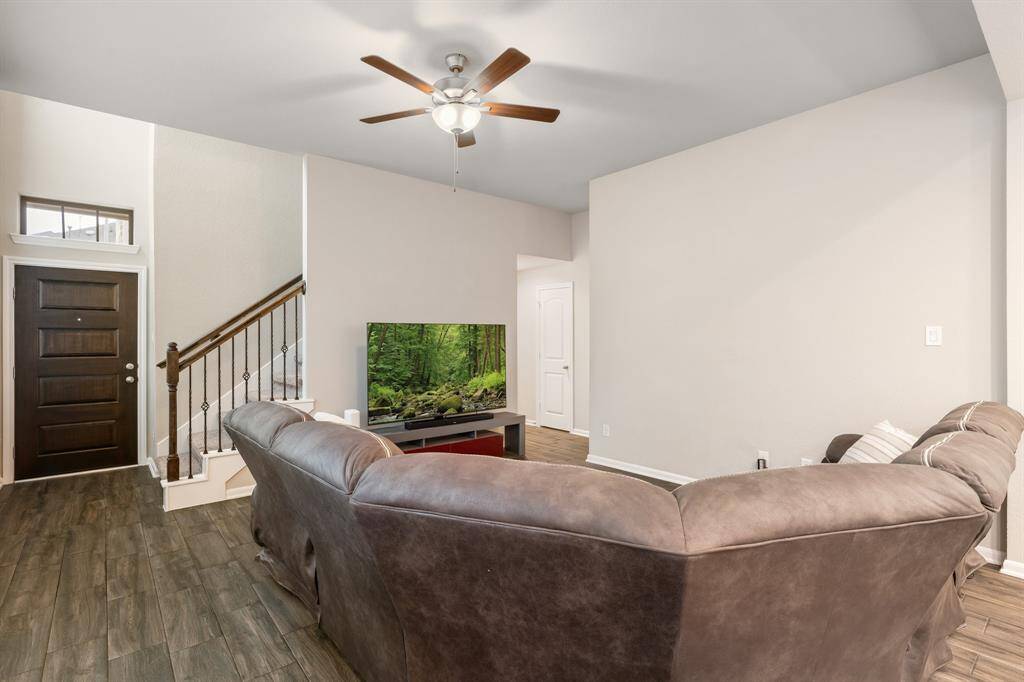 The entry leads you into the spacious living area, creating a seamless flow throughout the home. Plus, the stairs to the upper level are conveniently located, offering easy access to the private spaces upstairs.