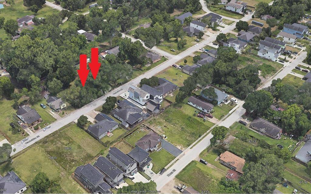 Well maintained streets and sidewalk, with new construction all around.