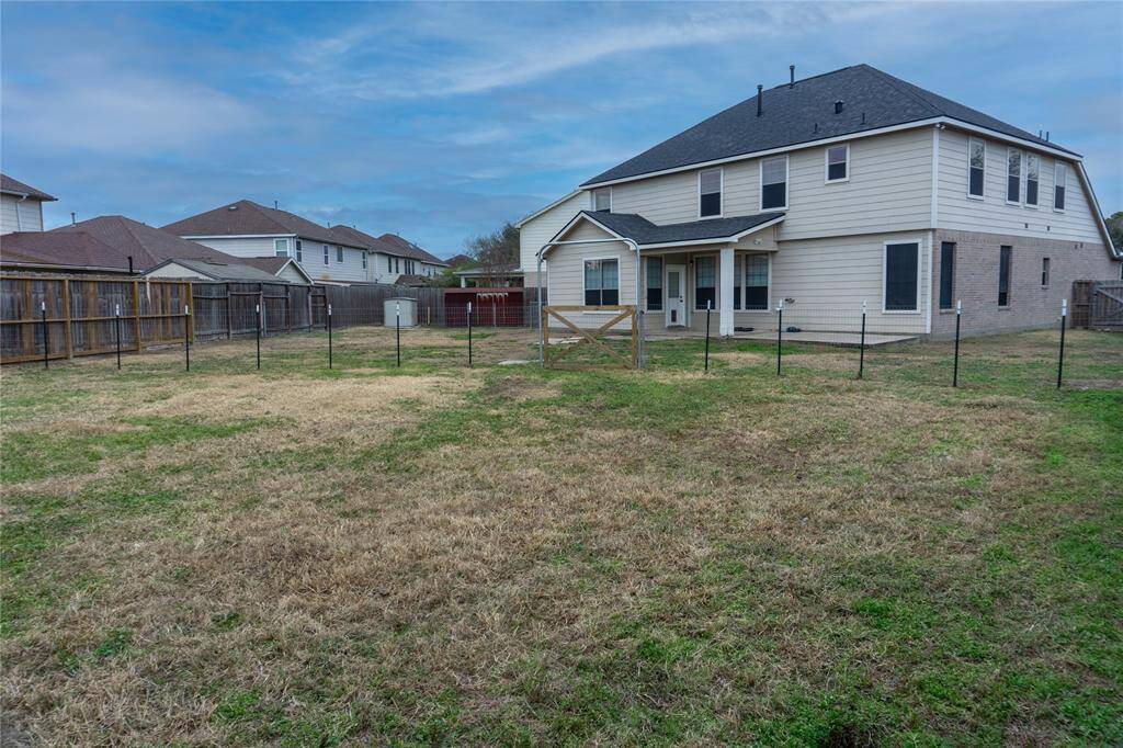 Huge back yard! Perfect for a pool or entertaining!