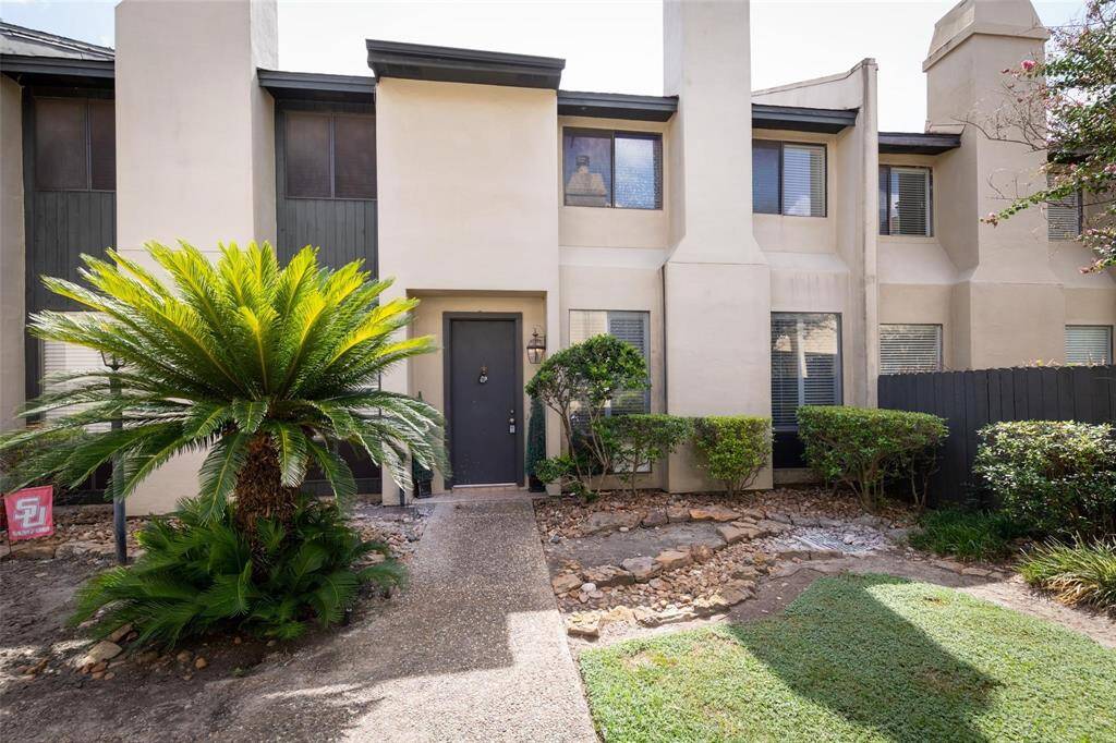 Enter your home through the nice, manicured courtyard.