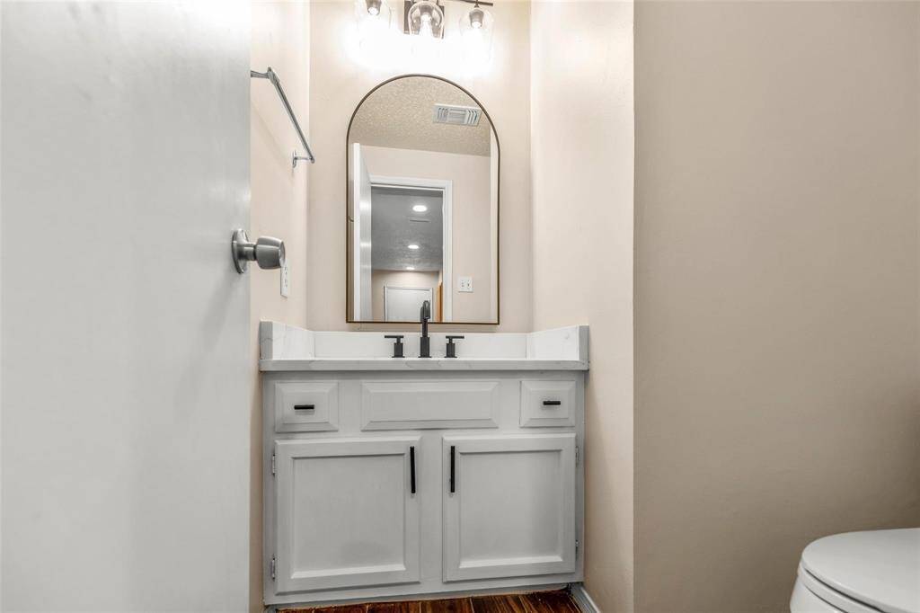 Updated 1/2 bath across from the kitchen.