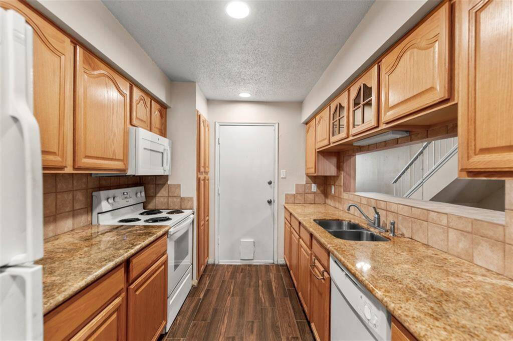 Plenty of cabinet and counter space. The door leads straight to the 2-car garage.