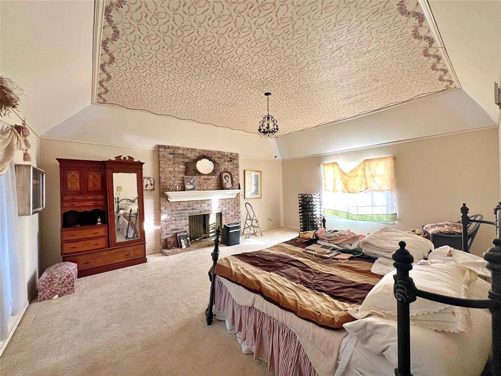 Primary Bedroom with fireplace and sitting room.
