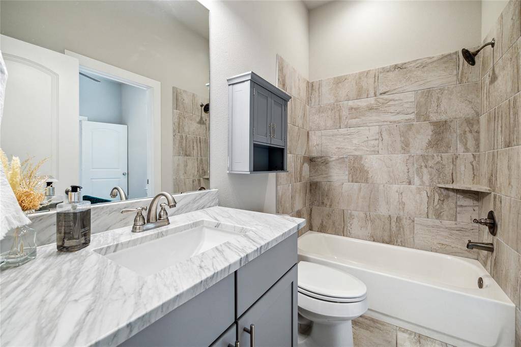 Elegant details are found in every corner of the home, including modern tile and quartz counters!*Home furnishings may differ*