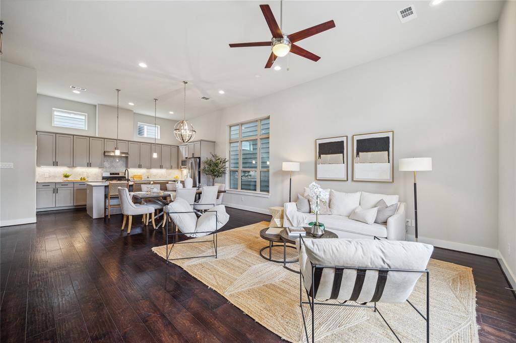 Never miss a minute of the action with this open concept design! Soaring ceilings and windows create an open an airy feel! *Home furnishings may differ*