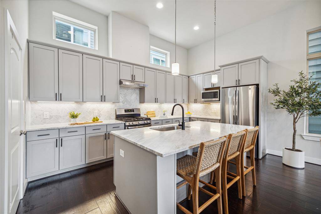 This oversized kitchen island provides the perfect place to gather with friends, or enjoy a quick breakfast before your day begins! An abundance to cabinets provides ample space for all your personal items.
