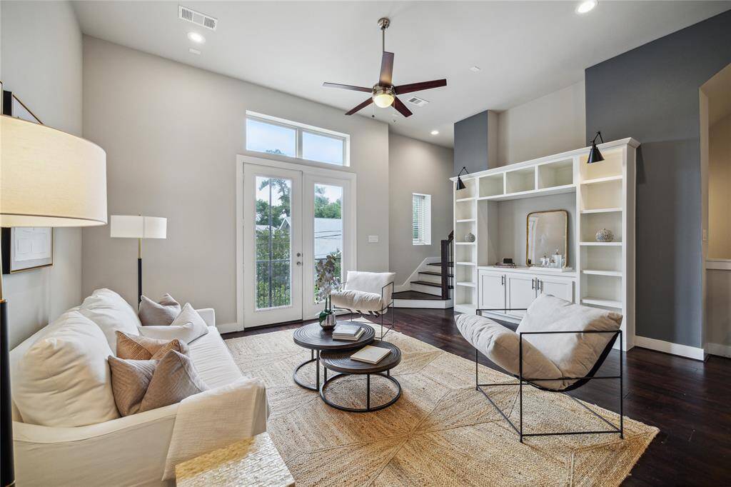 Oversized french doors welcome natural light to fill this great space! *Home furnishings may differ*