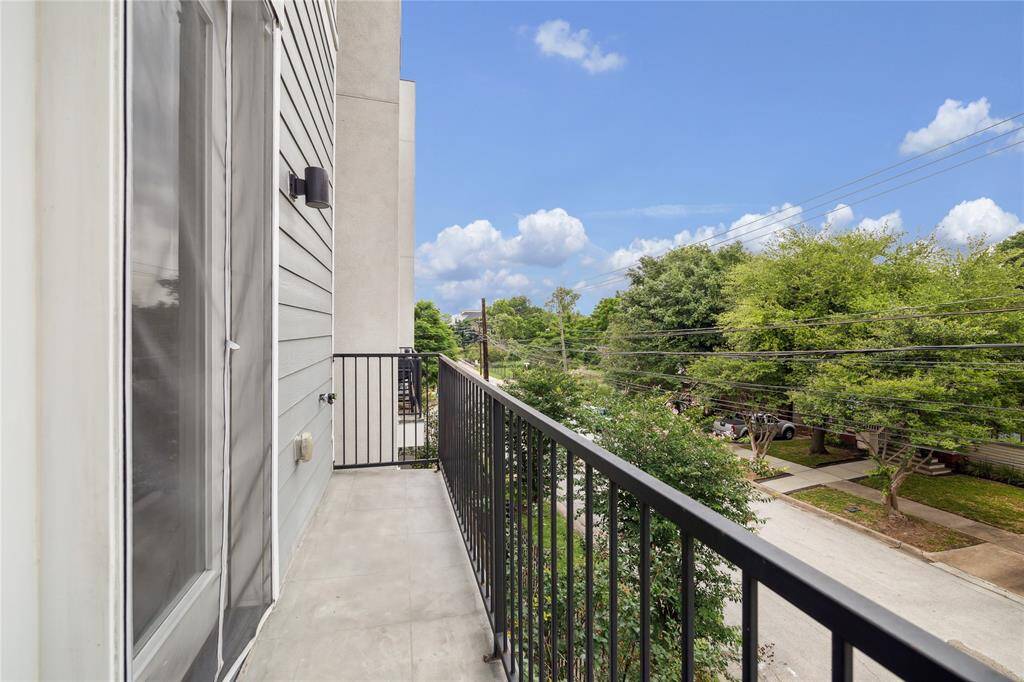 Open the french doors to this Juliet balcony with lovely city views!