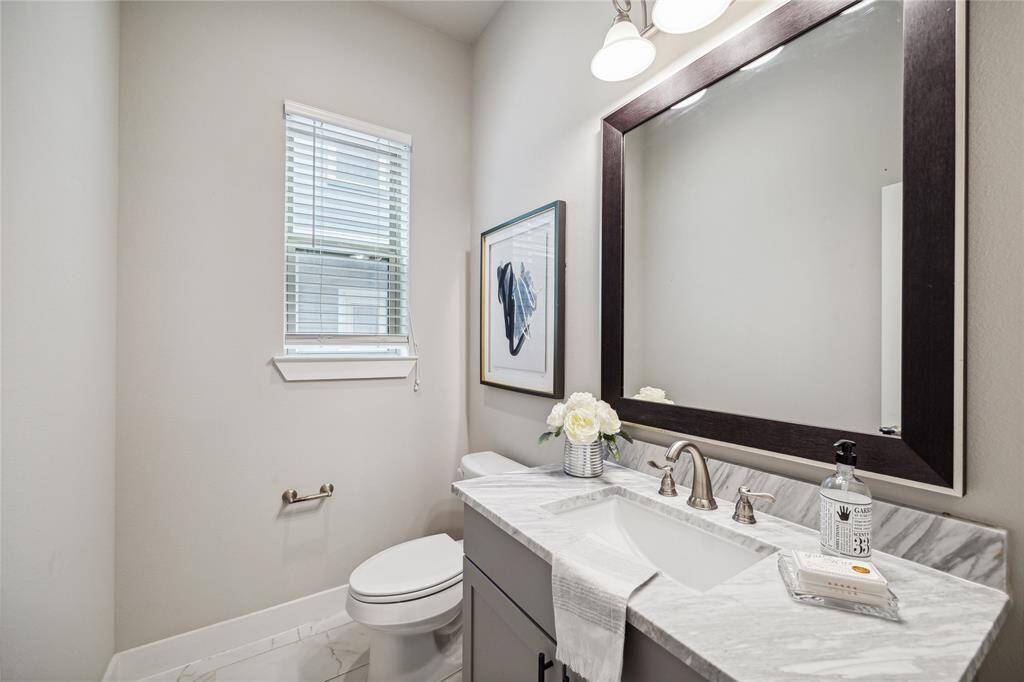 A lovely powder room is available next to the living area for your convenience.*Home furnishings may differ*