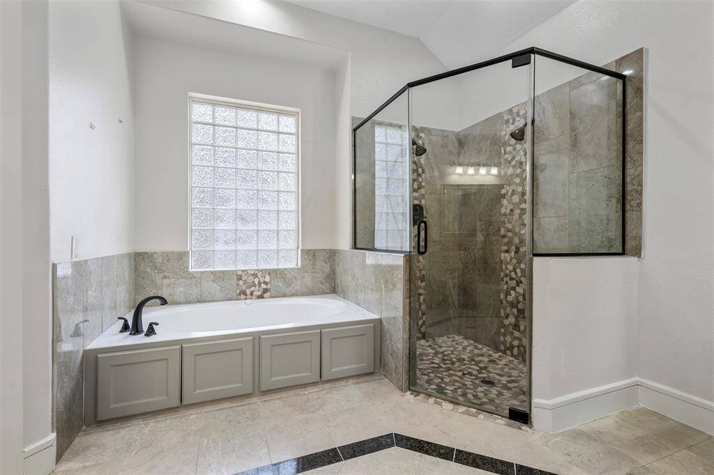 A view of the tub and shower.