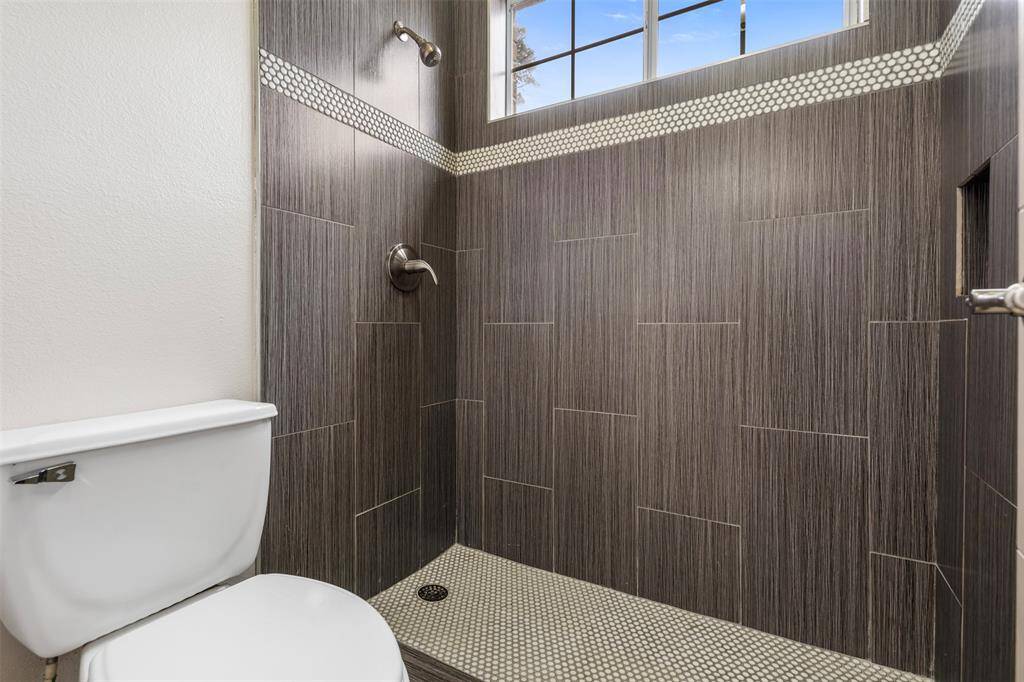 Shower to the shared bathroom.
