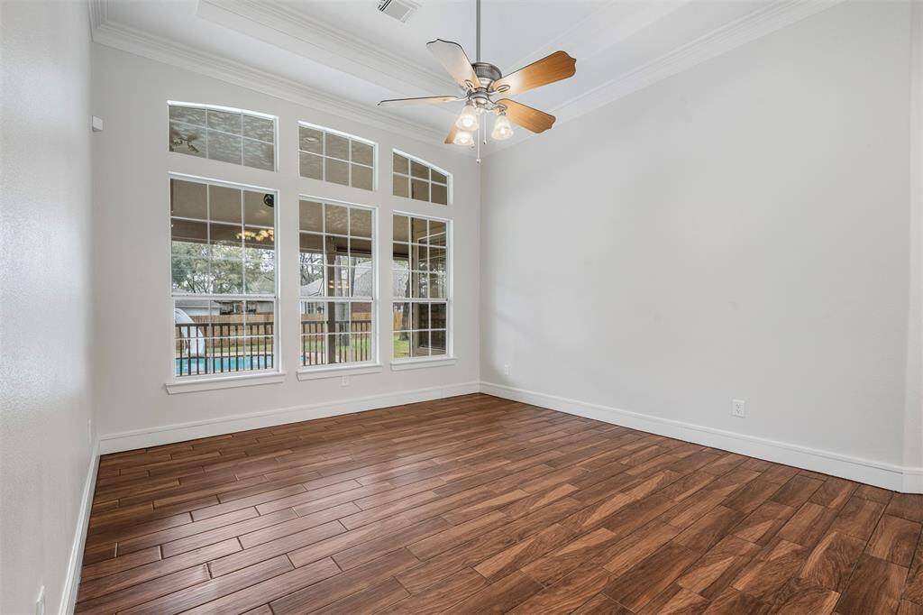 The view of your formal dining or office area sits at the front of the home with a wall of windows.